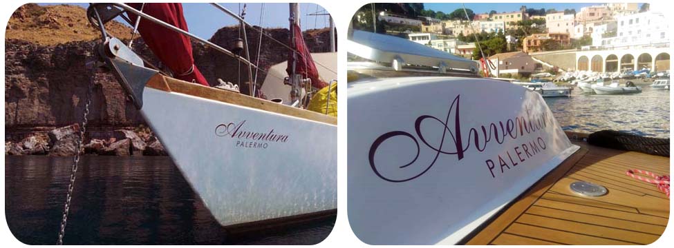Dettagli nome di Avventura Dettagli di prua e poppa con il nome della barca a vela Avventura